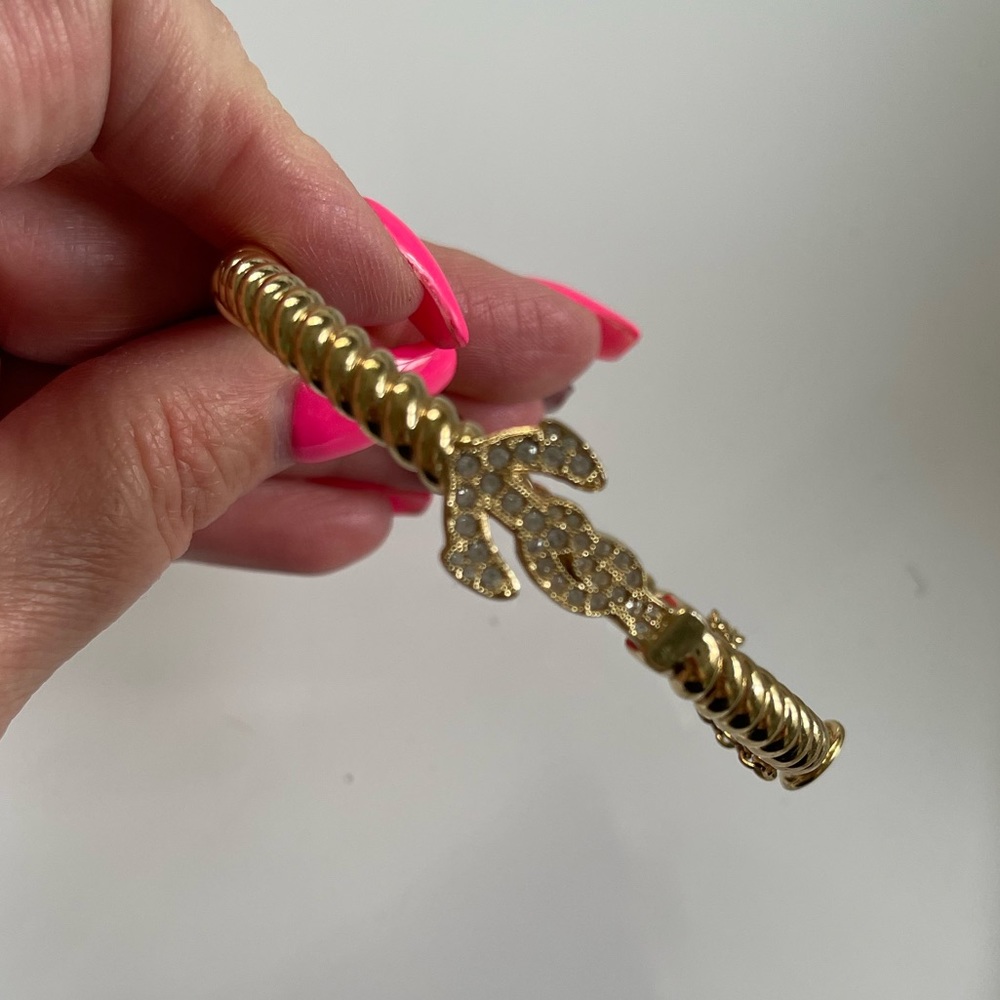 Coach anchor gold enamel bangle.